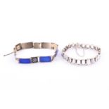 A silver and moonstone bracelet, set with oval cabochon moonstones in claw settings, fastened with a