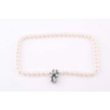 A cultured pearl necklace, fastened with an emerald and diamond clasp, set with mixed emerald-cut