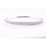 A diamond set hinged bangle, pavé set with one hundred and twenty seven round brilliant cut diamonds