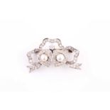 A late 19th / early 20th century diamond and pearl sweetheart brooch, the ribbon surmount and