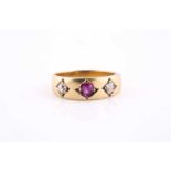 An 18ct yellow gold, diamond, and ruby ring, with bright-cut set ruby, and two old-cut diamonds,