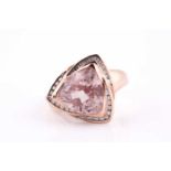 A 9ct rose gold, diamond, and morganite ring, set with trillion-cut morganite, measuring