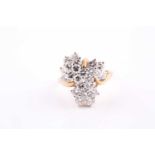 A 14ct yellow gold and diamond cluster cocktail ring, set with twenty-two round brilliant-cut