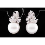 An 18ct white gold, diamond and South Sea pearl earrings, the stylise mounts set with round