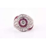 A French mid century diamond and ruby ring, centred with a round-cut diamond of approximately 0.22