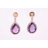 A pair of amethyst and diamond drop earrings, with three graduated round brilliant cut diamonds