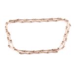 A 9ct yellow gold bone-link chain necklace, comprised of pinched fancy-links, the clasp marked