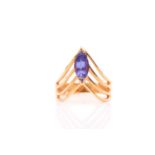 An 18ct yellow gold and tanzanite ring, the wishbone style mount set with a marquise-cut