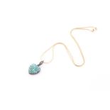 A Victorian turquoise pavé set heart-shaped pendant, with vacant glazed panel to reverse and three