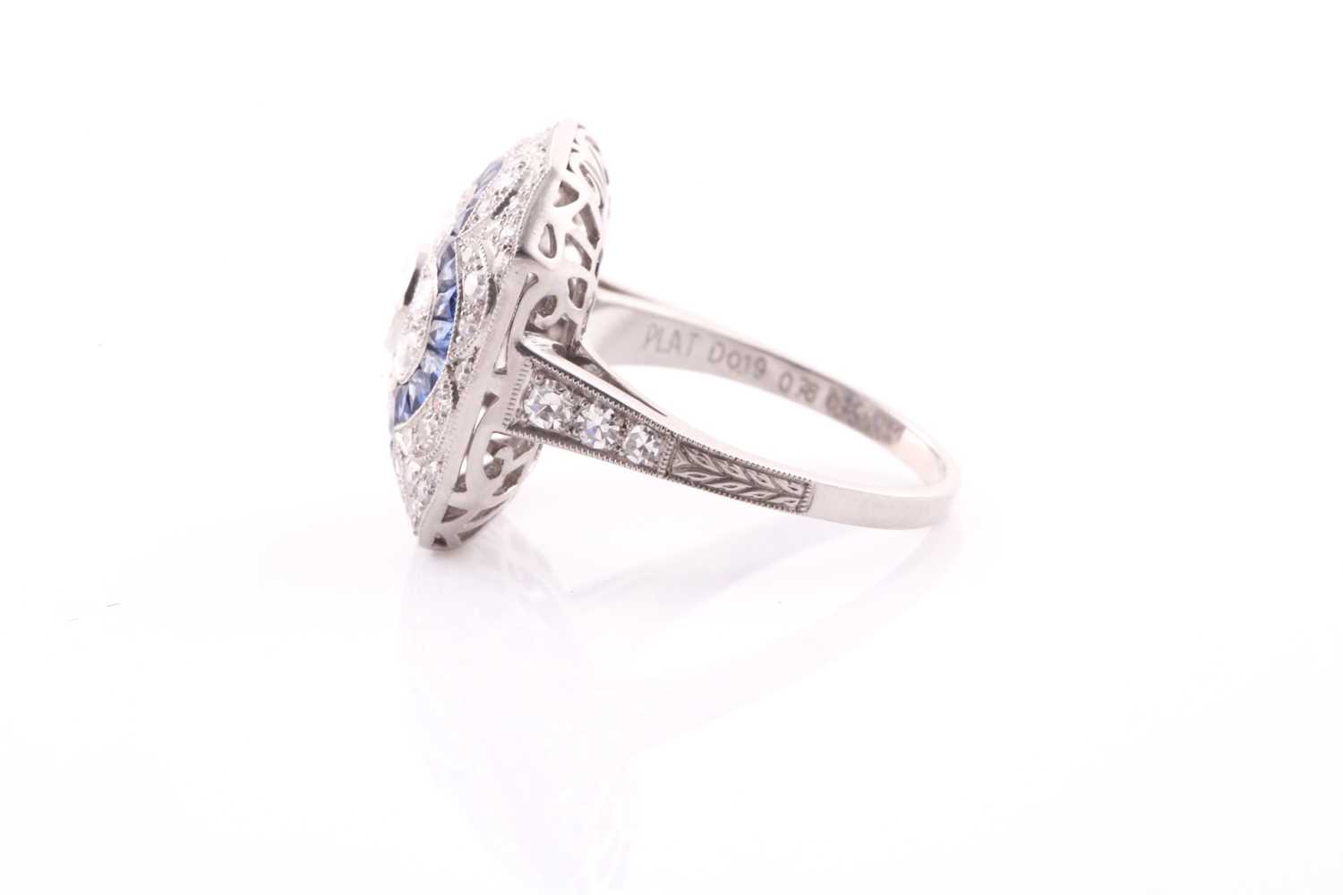 A platinum, diamond, and sapphire cocktail ring, set with a central quatrefoil floral design, within - Bild 4 aus 7