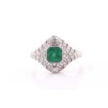 A platinum, emerald, and diamond ring, centred with a mixed square-cut emerald of approximately 0.79