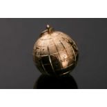 A yellow metal globe pendant, with engraved and textured design, approximate diameter 18 mm,