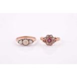 A rose gold and opal ring, set with three round cabochon opals, shank unmarked, size N, 2.2 grams,