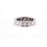 A diamond and platinum full eternity ring, set with sixteen round brilliant-cut diamonds, of