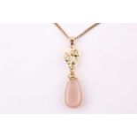A diamond and pear shape moonstone pendant, on 18ct yellow gold mount, diamonds weighing 0.12 carats