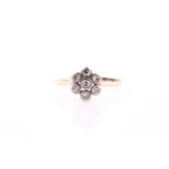 An 18ct yellow gold and diamond daisy cluster ring, set with old-cut diamonds, cluster approximately