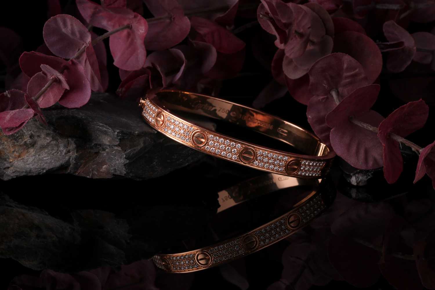 Cartier. A diamond set Love bangle; in 18 carat rose gold; set with 204 round brilliant cut