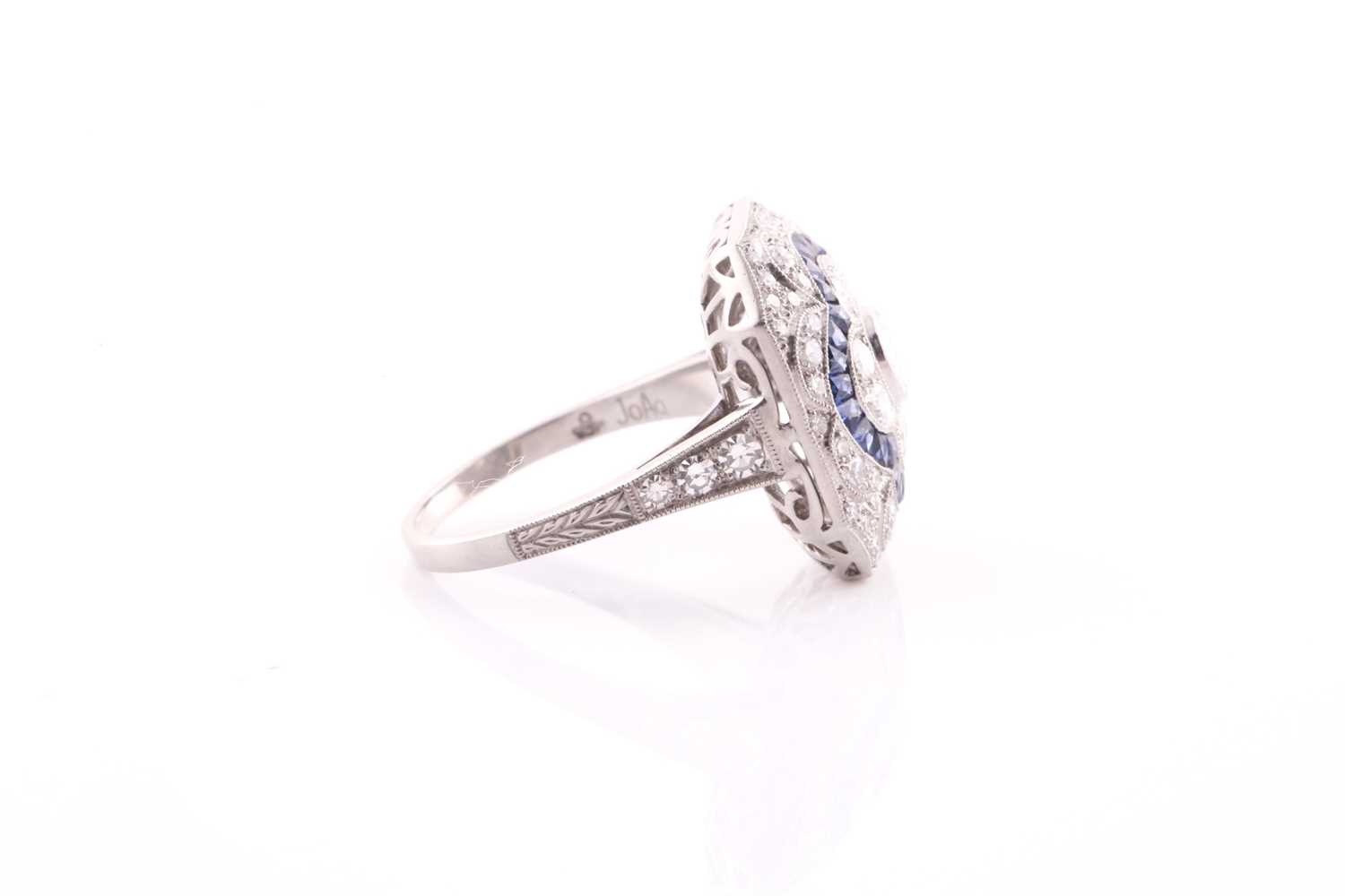 A platinum, diamond, and sapphire cocktail ring, set with a central quatrefoil floral design, within - Bild 7 aus 7