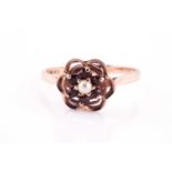 A 9ct yellow gold, garnet and pearl dress ring, size S 1/2, 2.7 grams.Condition report: Could be