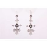 A pair of diamond drop earrings with foliate and floral design, pave-set with small diamond,