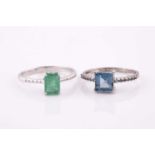 A 9ct white gold and emerald ring, set with a mixed rectangular-cut emerald, measuring approximately