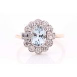 An 18ct yellow gold, diamond, and aquamarine ring, set with a mixed oval-cut aquamarine surrounded