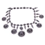 A Victorian Vauxhall glass necklace, by Charles Packer, with cut black glass floral and faceted oval