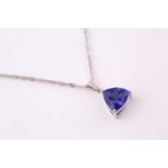 A tanzanite and diamond pendant, the triangular cut tanzanite measuring 11mm x 11mm approximately,