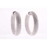 A pair of 18ct white gold and diamond earrings, pave-set with five rows of round brilliant-cut