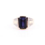 A 14ct yellow gold, diamond, and iolite ring, set with a mixed rectangular-cut iolite, measuring