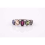 A 9ct white gold and rainbow gemstone ring, with five multi-claw set mixed oval-cut gemstones,