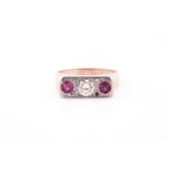 A 9ct yellow gold, diamond and ruby ring, centred with a round-cut diamond of approximately 0.25