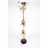 A 1970s "Hollywood Regency" gilt metal uplighter standard lamp, probably by Lancia of Italy. The