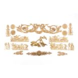A collection of French Empire style gilt metal furniture mounts, the largest 56 cm wide.