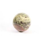 A green and red striated marble sphere, 27cm diaPurchased in Zurich from Antares Stones, 1st