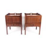 A pair of George III style mahogany tray topped night cupboards, each with a tambour closure and