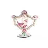 A Royal Dux Art Deco ceramic three-sconce candlestick, modelled with a nude female dancer, on a