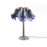 A 'Tiffany Studios New York' seven-lamp glass 'Lily' table lamp, the purple opalescent shades formed