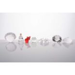 A collection of eight small boxed Swarovski crystal glass items, variously modelled.Qty: 8