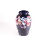 A large Moorcroft baluster vase of shouldered form, decorated with the 'Orchid and Spring Flower'