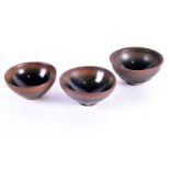 Three Chinese Jian ware 'Hares Fur' tea bowls, Ming and later, each with deep rounded sides, the