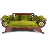 A 19th century probably American 'Empire' style mahogany scroll end sofa, with carved stuff over