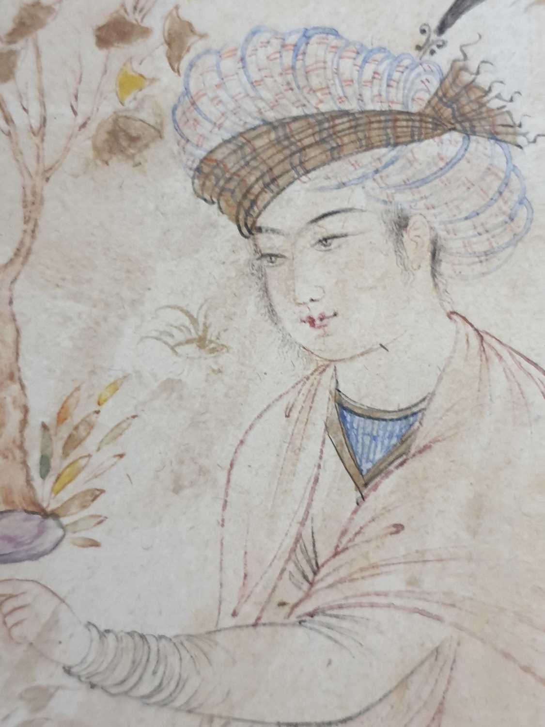 Mughal school, 19th century, a nim qalam pen and coloured ink Prince in a garden, kneeling whilst - Image 3 of 7