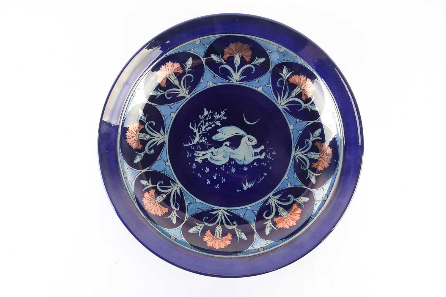 A contemporary Arts & Crafts style blue lustre charger, in the manner of John Pearson, the well with