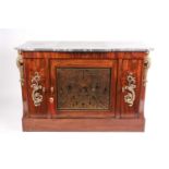 A French Empire style marble-topped mahogany commode a vantaux. Fitted a central with brass inlaid