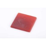 An Indo Persian hardstone intaglio seal, the square plaque with engraved decoration.