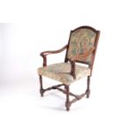 A French Regency style walnut open armchair, 19th century, with arched square back, swept moulded