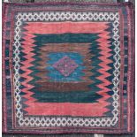 A 20th-century blue ground small Iranian Kelim rug with zigzag alternating ground and flowerhead