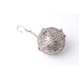 A probably Indian white metal spherical hanging pomander, 20th century, with an engraved and pierced