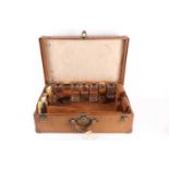 A fine early 20th-century tan leather travelling case by Louis Vuitton, with brass mounts and
